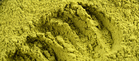 Henna, wheat grass or matcha powder close-up shooting