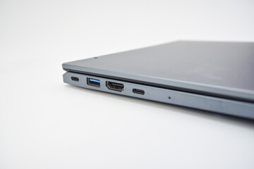 Closed laptop showing side ports including USB, HDMI, and Type-C, concept of connectivity, modern technology, and portable computer design.