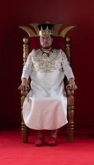 king in white robe on throne
