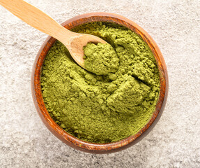Henna, wheat grass or matcha powder on vintage background
