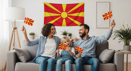 Joyful Macedonian family celebrating with flags, embracing national pride and unity at home