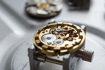 Wrist watch mechanism. Mechanical steel clockwork with cogwheel and screw