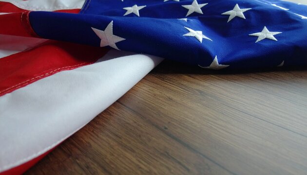 The American flag with stars and stripes resting on a wooden surface, a powerful symbol of patriotism and freedom. - Powered by Adobe