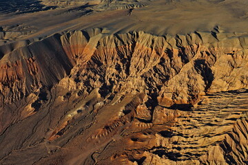 The Red Mountains of Boguta. Mountainous clay terrain. The view from the drone. Summer evening...