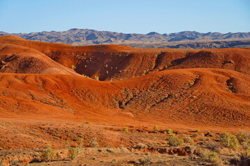 The Red Mountains of Boguta. Mountainous clay terrain. Summer evening time. National Nature Park.