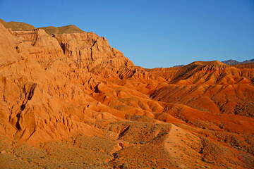 The Red Mountains of Boguta. Mountainous clay terrain. Summer evening time. National Nature Park.