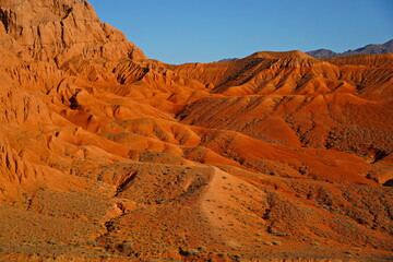 The Red Mountains of Boguta. Mountainous clay terrain. Summer evening time. National Nature Park.
