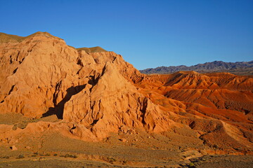 The Red Mountains of Boguta. Mountainous clay terrain. Summer evening time. National Nature Park.
