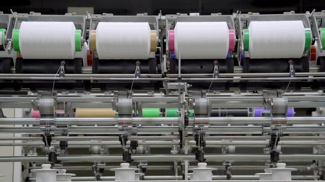 Texture manufacturing factory yarn processing large spools of yarn winding texturizing
