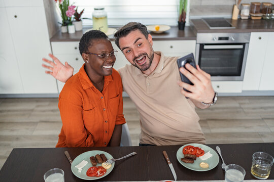 Happy Couple Taking Selfie While Having Breakfast in the Kitchen