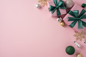 Festive pink background featuring neatly wrapped gifts, holiday ornaments, and golden snowflakes...