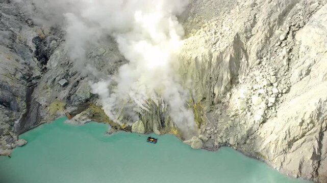 Drone Pan Over Sulfur Workers and Smoke at Kawah Ijen Volcano