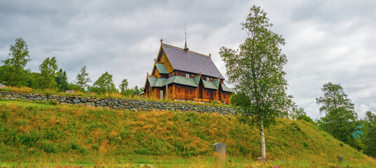 A preserved wooden parish church, a stave church, in the countryside of Norway, August, 2025