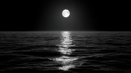 Moonlit ocean with reflection of light on the water surface at night