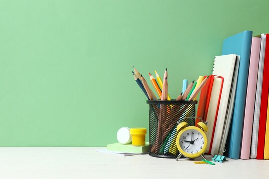 A back to school concept featuring various school supplies and notebooks
