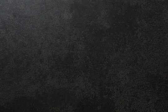 Dark grey textured concrete wall background