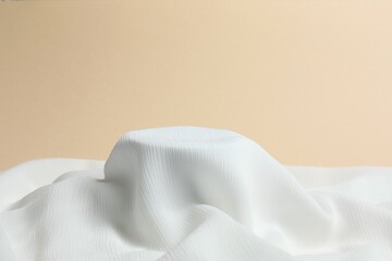 Satin cloth podium for product presentation. Modern trendy fabric pedestal, scene mockup