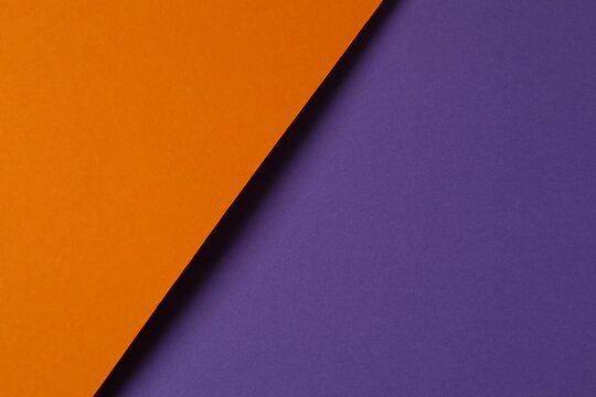 Two tones of orange and purple paper background.