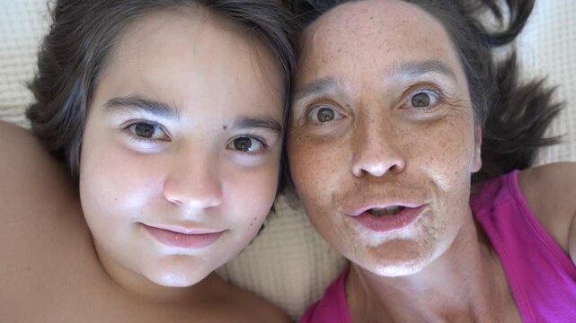 Fethiye, Turkey - 21st of August 2025: 4K Portrait of mother and son shooting Selfie after long break
