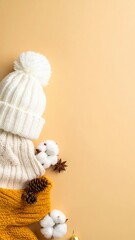 Fototapeta premium Cozy winter accessories arranged on a light-colored backdrop, creating a warm and inviting scene for the cold season. The composition includes a knitted hat, a cozy sweater, and a soft scarf.