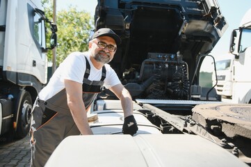 Professional truck mechanic working in vehicle repair service