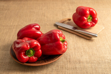 Sweet red bell pepper on jute cloth, macro.