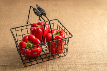Sweet red bell pepper on jute cloth, macro.