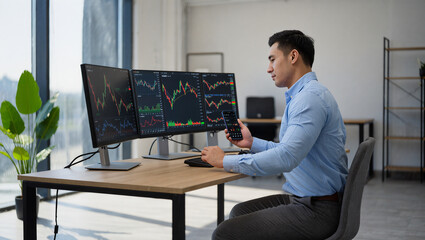 A professional man in a modern office is using multiple monitors to analyze cryptocurrency charts and trends. He is also checking a smartphone, showcasing the dynamic and multi-platform crypto trading