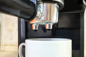 Close up Espresso coffee machine piston. Espresso machine with white cup of coffee in the home...