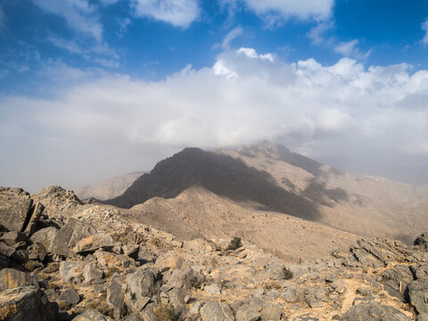 Mountain ridge in the Hajar mountains under cloudy sky Ras Al Khaimah UAE