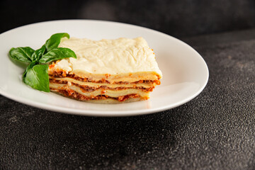 Lasagna bolognese béchamel sauce, meat, cheese second course tasty snack fresh delicious gourmet food background on the table rustic food top view copy space