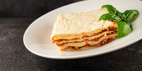 Lasagna bolognese béchamel sauce, meat, cheese second course tasty snack fresh delicious gourmet food background on the table rustic food top view copy space