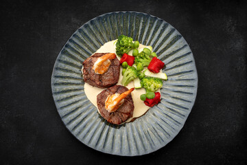 Grilled Meat Medallions with Shrimp, Sauce and Vegetables