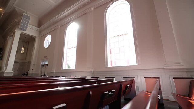 Empty Chapel Sanctuary Tracking Over Pews With Sunlight Lens Flare Through Window