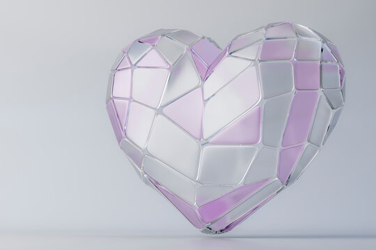 Geometric glass heart sculpture in pastel colors on white background