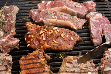 delicious steaks are being cooked on the grill