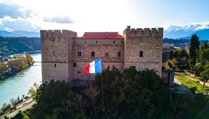 Scenic aerial view of a medieval castle by a river