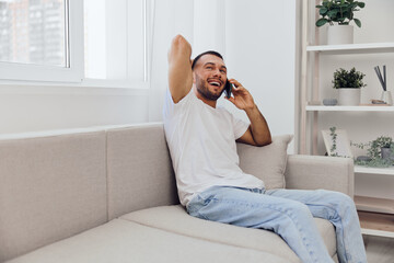 Happy man talking on the phone, embracing emotional connection and vulnerability, representing...