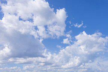 Clouds and daytime sky,Blue sky with scattered white cumulus clouds.
