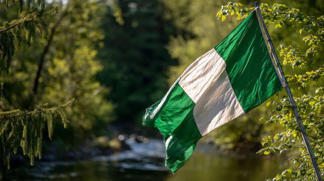 Nigeria flag waves proudly in the breeze celebrating Independence Day and Flag Day in a serene natural setting
