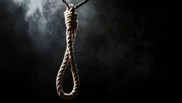 A noose made of rope hangs against a dark, smoky background, symbolizing danger, death, or despair.