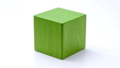 A vibrant green cube, sharply defined against a plain white background, displays a smooth, even surface.