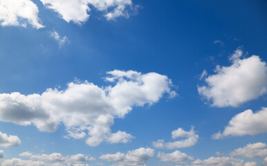 A beautiful blue sky with soft, white clouds, for an abstract background