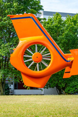 orange helicopter's tail, featuring its advanced Fenestron rotor system, Emergency rescue...