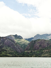 Mountain scenery view with river and cloudy skies