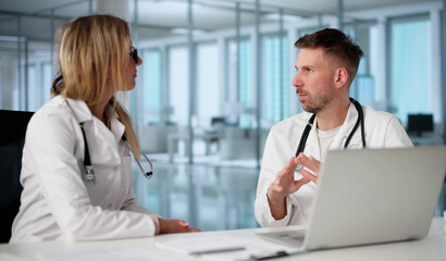 In A Hospital, Two Doctors Engage
