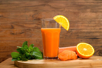 Refreshing orange and carrot juice with garnish