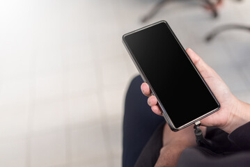 Hand Holding Smartphone with Blank Screen Mockup for App Presentation