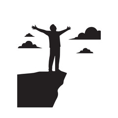 Silhouette of a person with arms outstretched on a cliff edge against a cloudy sky