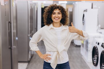 Woman Showing Thumbs Up While Shopping for Appliances